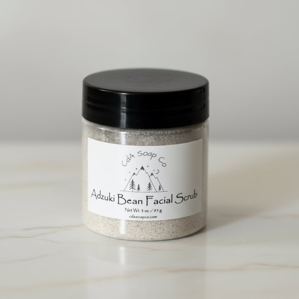 Jar of Adzuki Bean Facial Scrub with a black lid on a light surface
