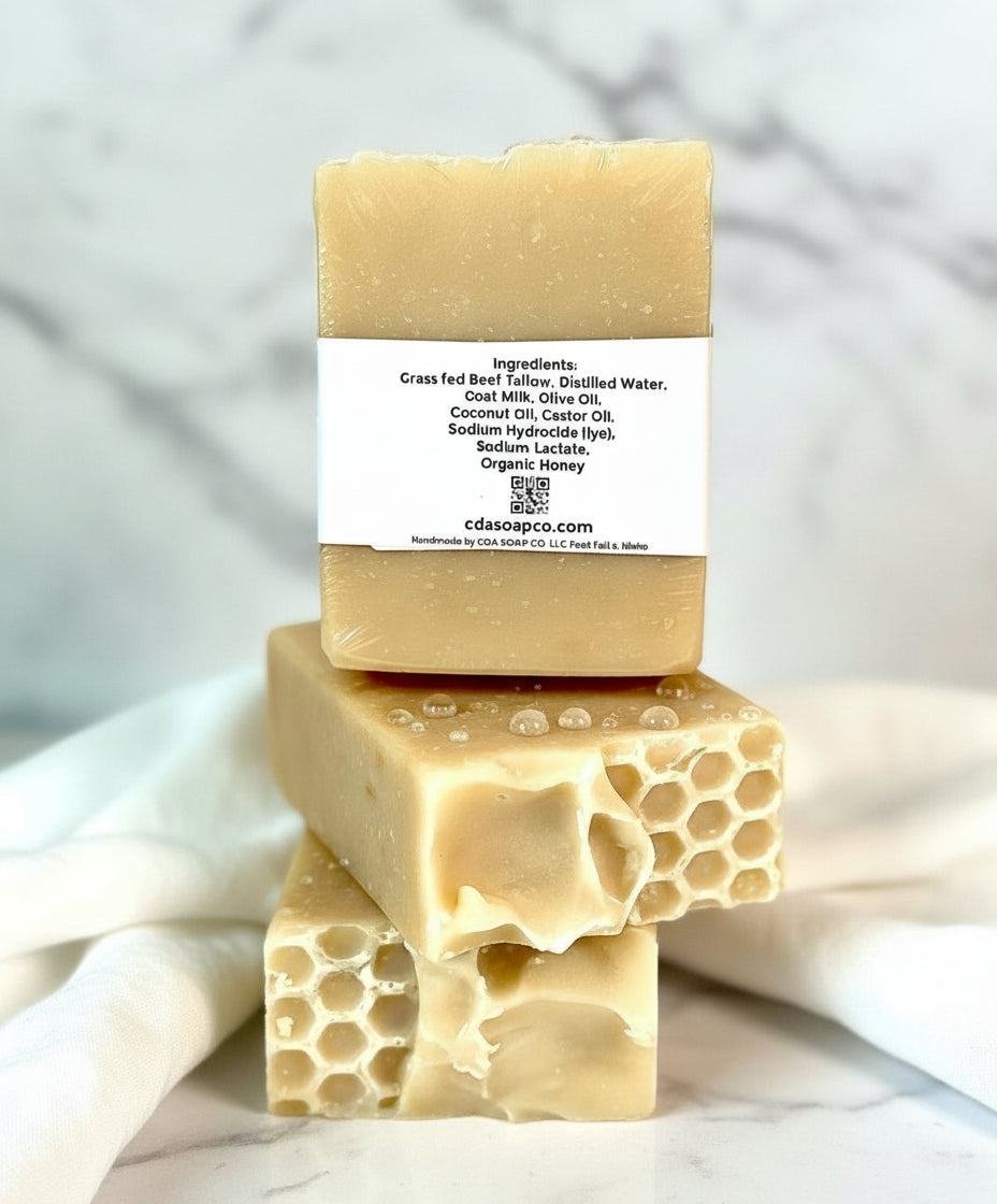 Three bars of soap with honeycomb design on a white background