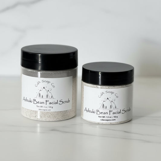 Two jars of Adzuki Bean Facial Scrub from Cda Soap Co on a light background
