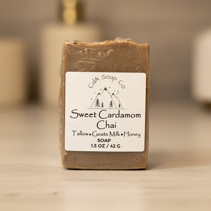 Bar of soap with a label on a wooden surface, featuring the brand 'CDA Soap Co'.