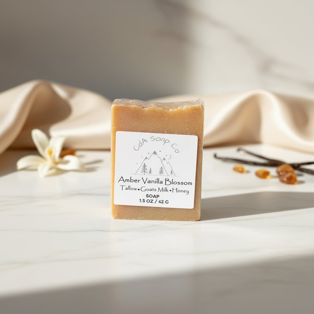 Bar of Amber vanilla blossom soap with a label on a light surface with a neutral background