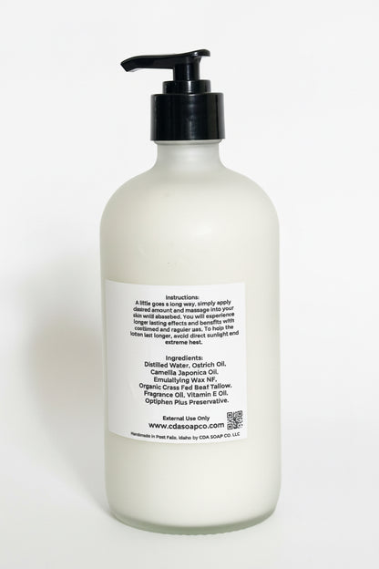 White bottle with black pump and label on a white background