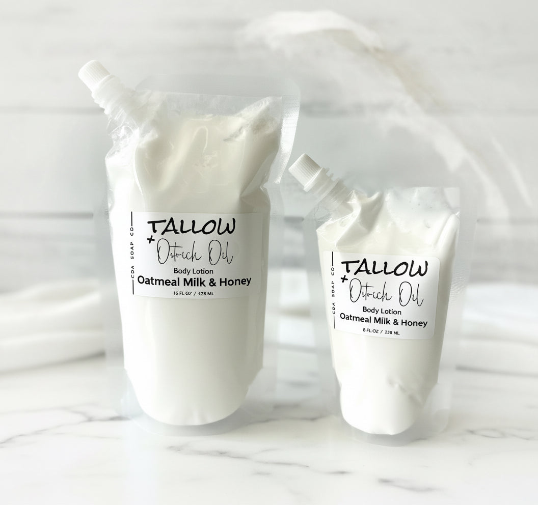 Two containers of Tallow Outback Oil body lotion on a white background