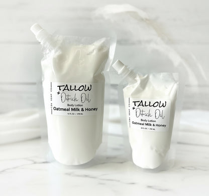 Two containers of Tallow Outback Oil body lotion on a white background