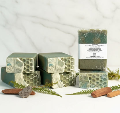 Three bars of soap with a visible label on a light background