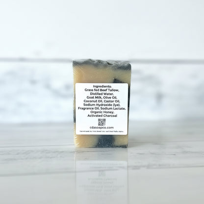 Bar of soap with a ingredient label on a marble surface