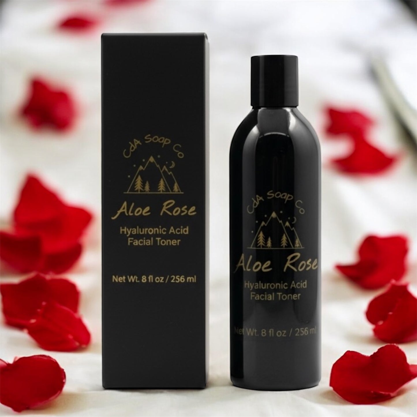 Aloe Rose Hyaluronic Acid Facial Toner bottle and packaging with red rose petals on a white background