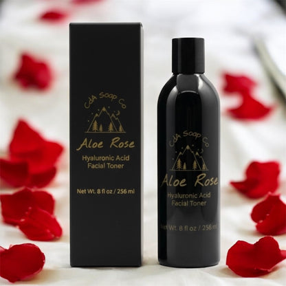 Aloe Rose Hyaluronic Acid Facial Toner bottle and packaging with red rose petals on a white background