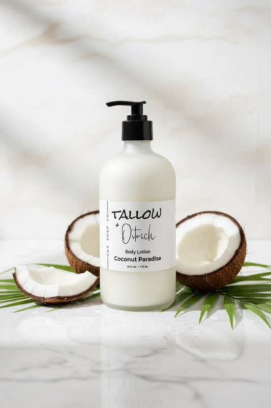 Commit paradise Tallow & ostrich oil CdA soap Co. body lotion bottle with coconuts and palm leaves on a marble background