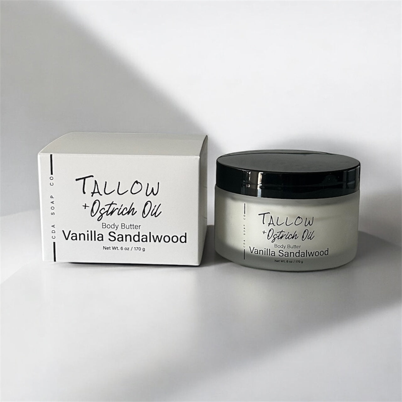 Vanilla sandalwood body butter jar and packaging on a white background