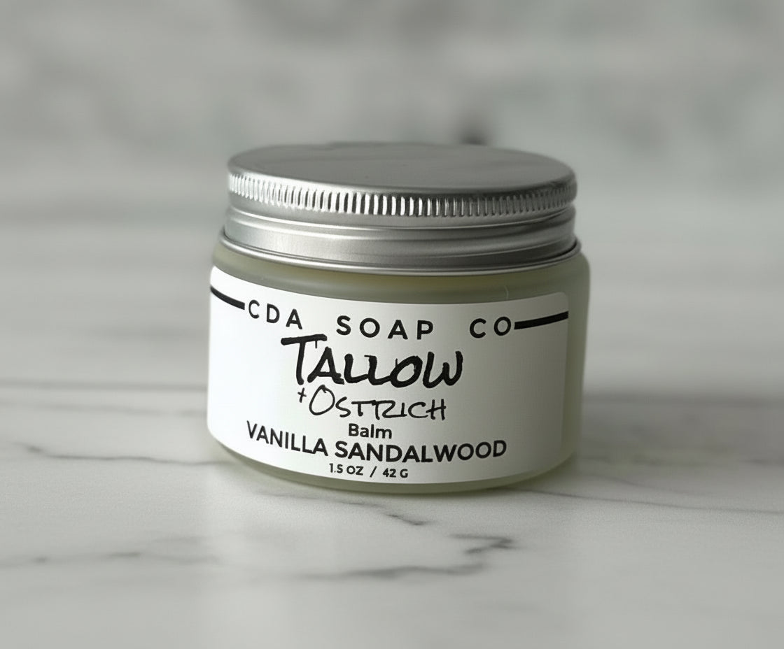 Jar of CDA Soap Co. balm on a gray background