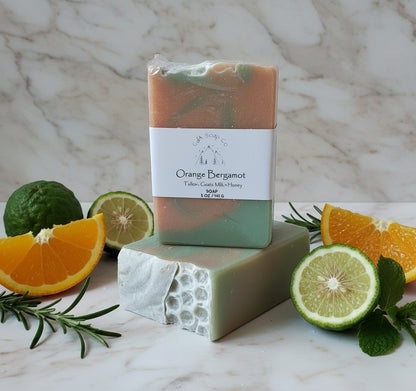 Two bars of soap with a visible brand label on a marble surface