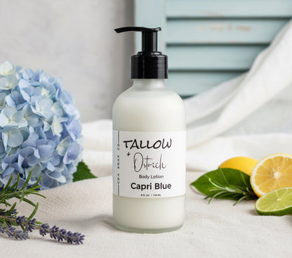 Bottle of Tallow + Ostrich Capri Blue body lotion on a wooden surface