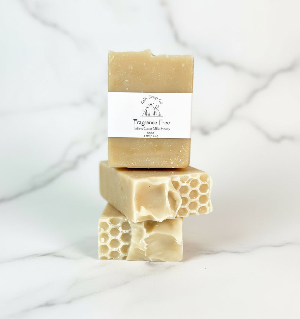 Three bars of soap stacked with a 'Fragrance Free' label