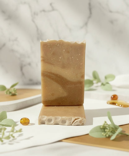 Bar of soap on a wooden stand with a blurred background
