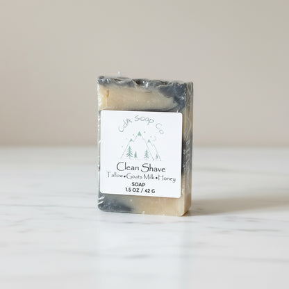 Bar of soap with a label on a wooden surface