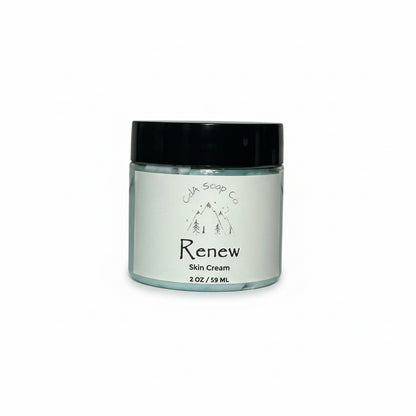 Jar of 'Renew' skin cream with a black lid on a white background