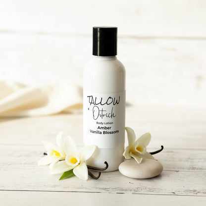 Body lotion bottle with vanilla flowers on a wooden surface
