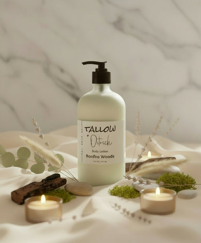 Bottle of Tallow + Ostrich body lotion labeled 'Bonfire Woods' on a linen surface with smoke and accents