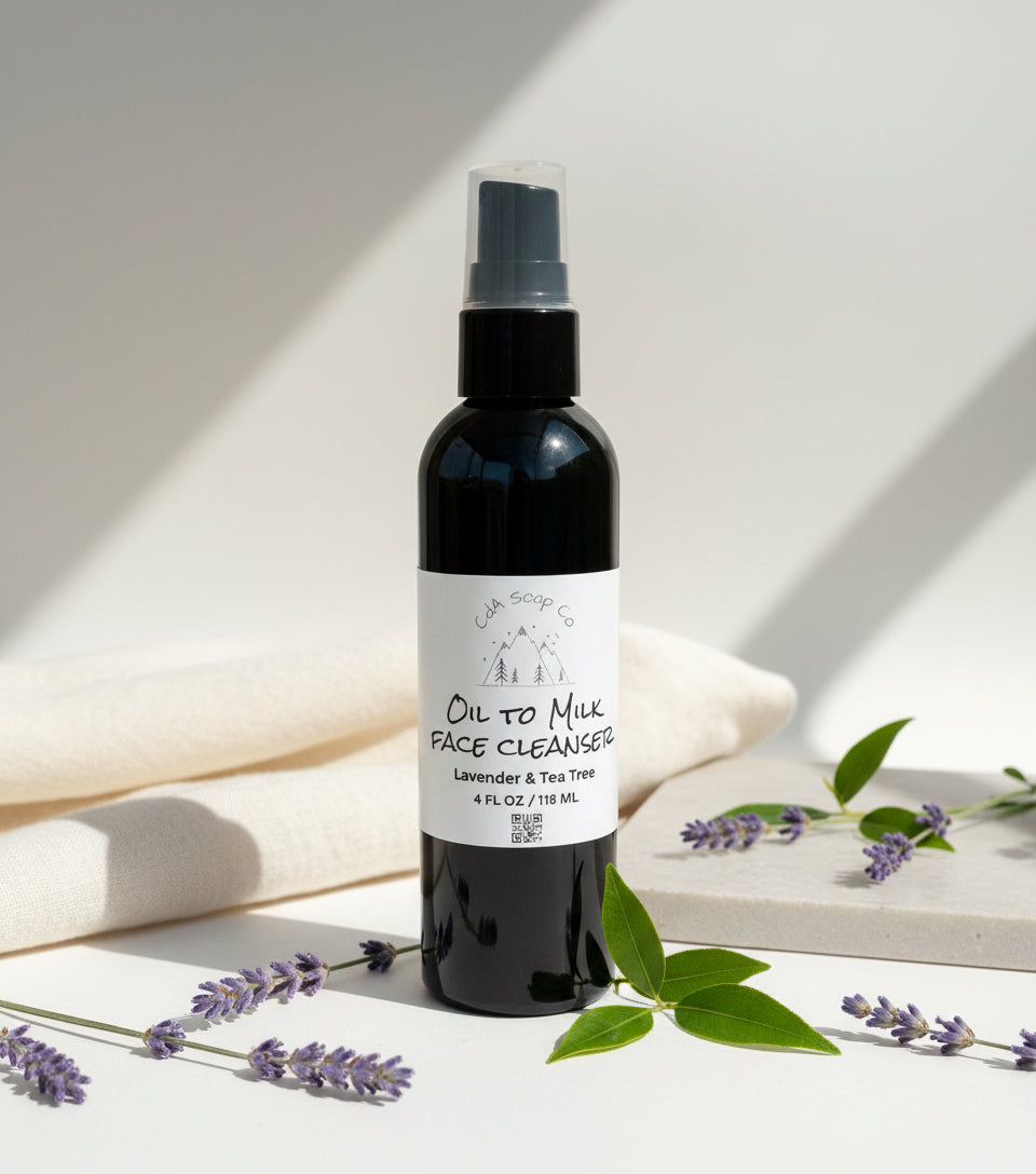 Black bottle of 'Oil to Milk Face Cleanser' on a white wooden background