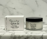 Capri Blue Tallow + Ostrich Oil body butter jar and box on a marble surface with wooden background