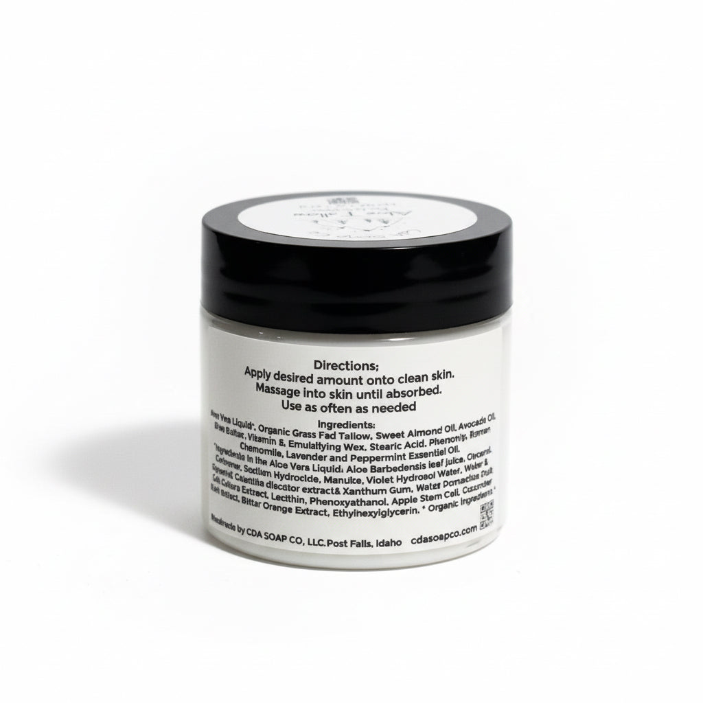 Jar of cream with black lid and white label on a white background