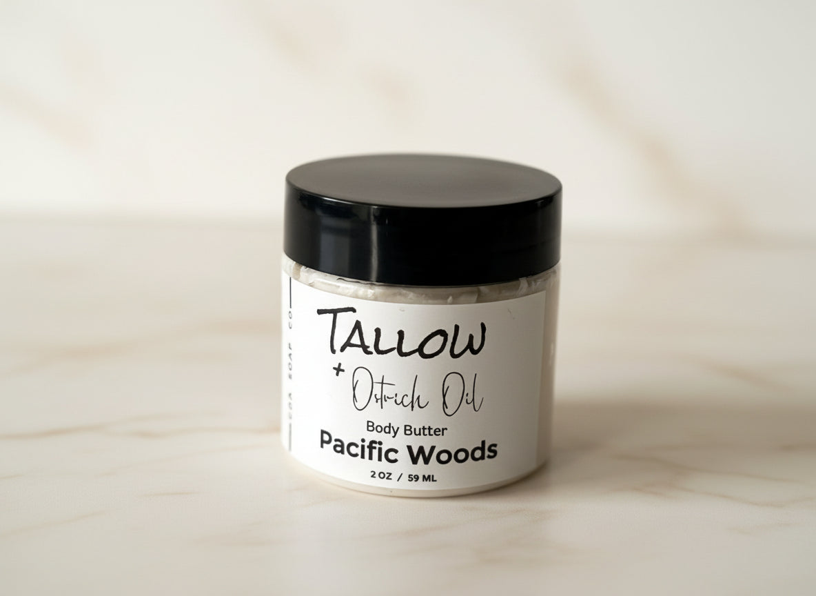 Jar of Tallow + Oatrich Oil body butter labeled 'Pacific Woods' on a gray background