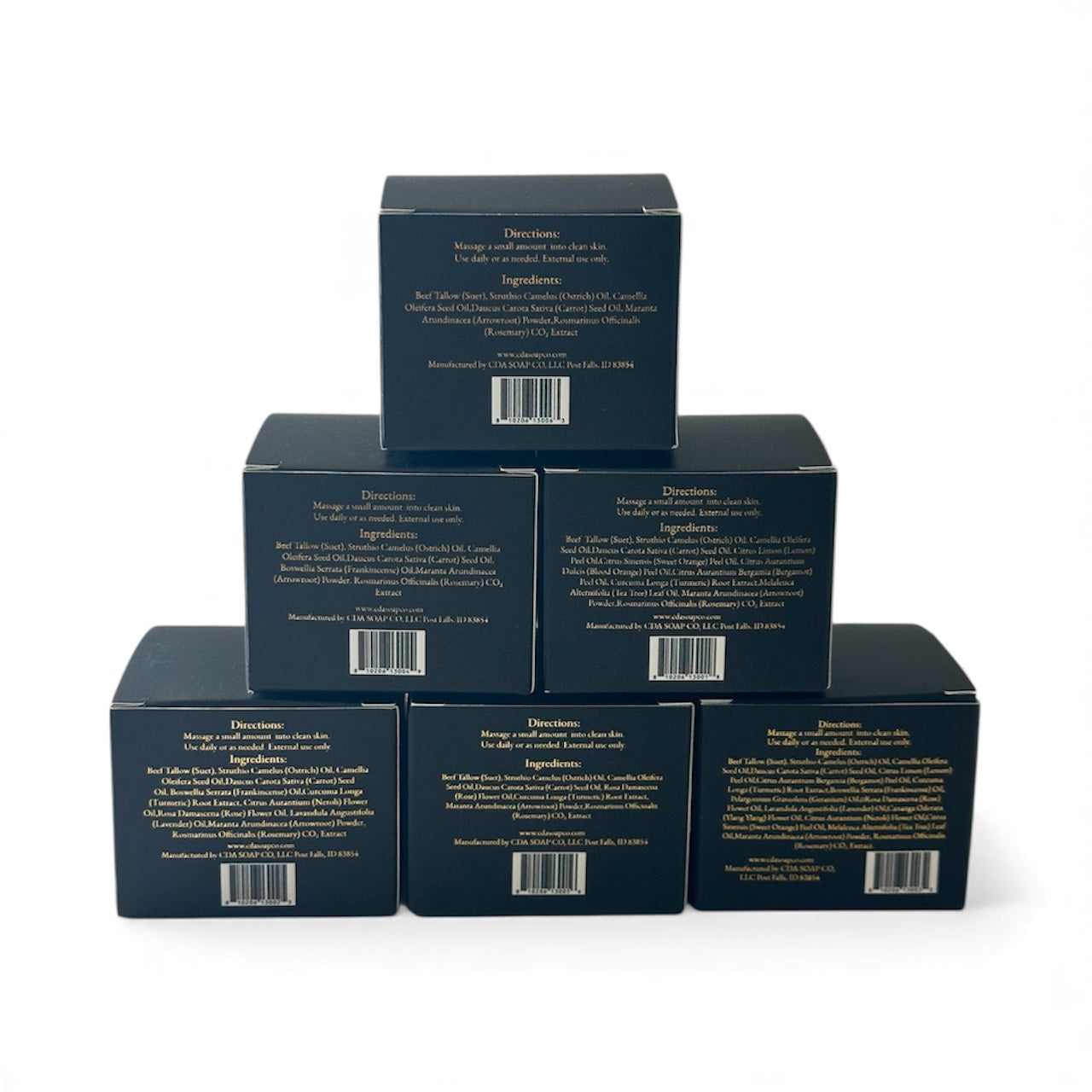 Stack of black cosmetic boxes with text and barcodes on a white background