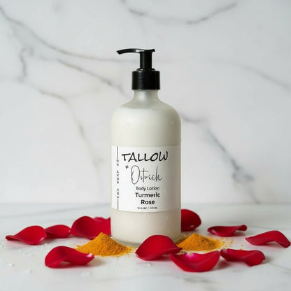 Body lotion bottle with turmeric and rose petals on a light background