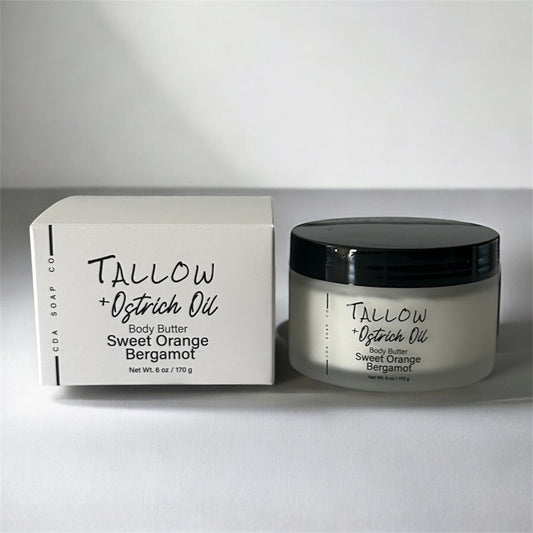 Tallow + Ostrich Oil Sweet Orange Bergamot body butter jar and packaging on a white background
