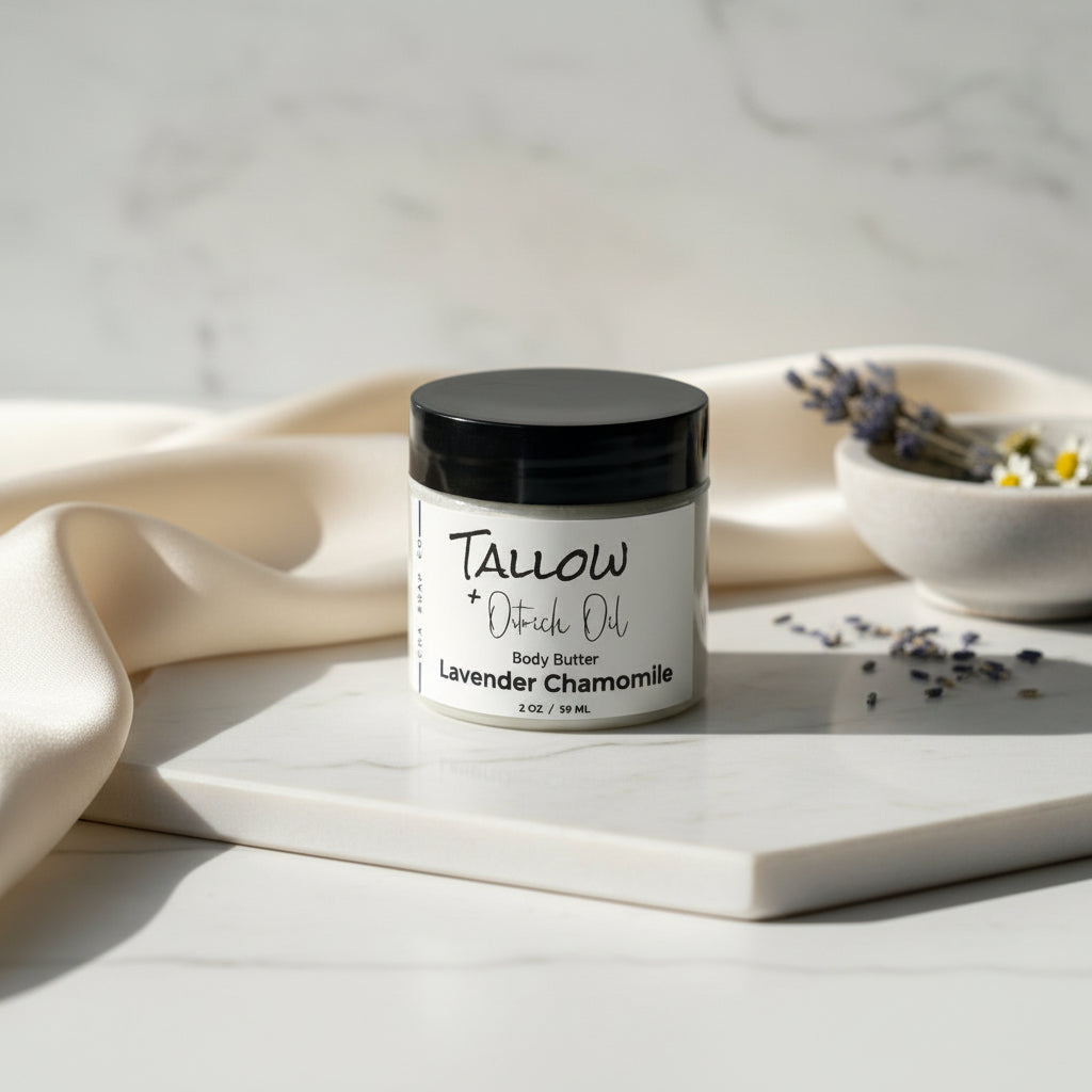 Jar of lavender chamomile body butter with a black lid on a gray surface.