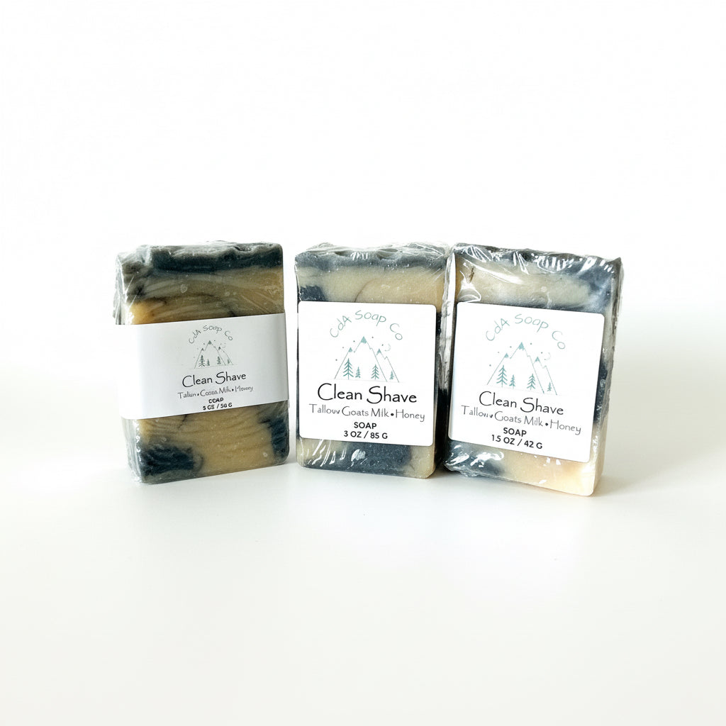 Three bars of Clean Shave soap in packaging on a white background