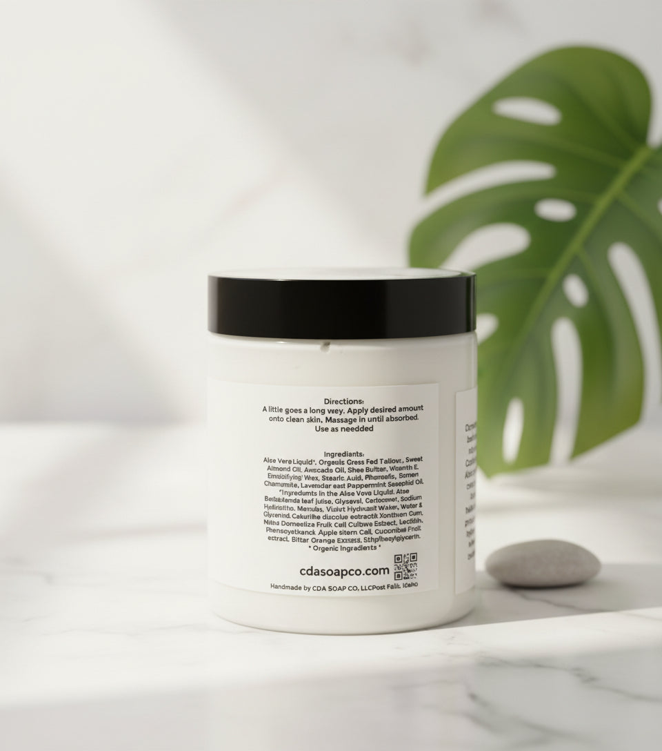 Jar of Aloe Tallow cream with a label on a wooden surface