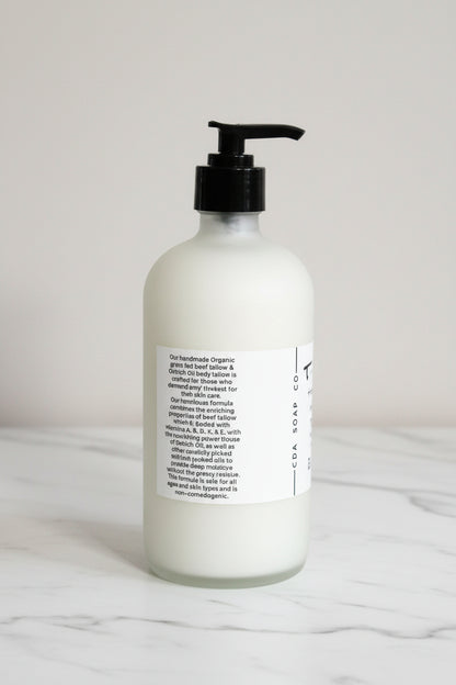 White bottle with black pump on a marble surface