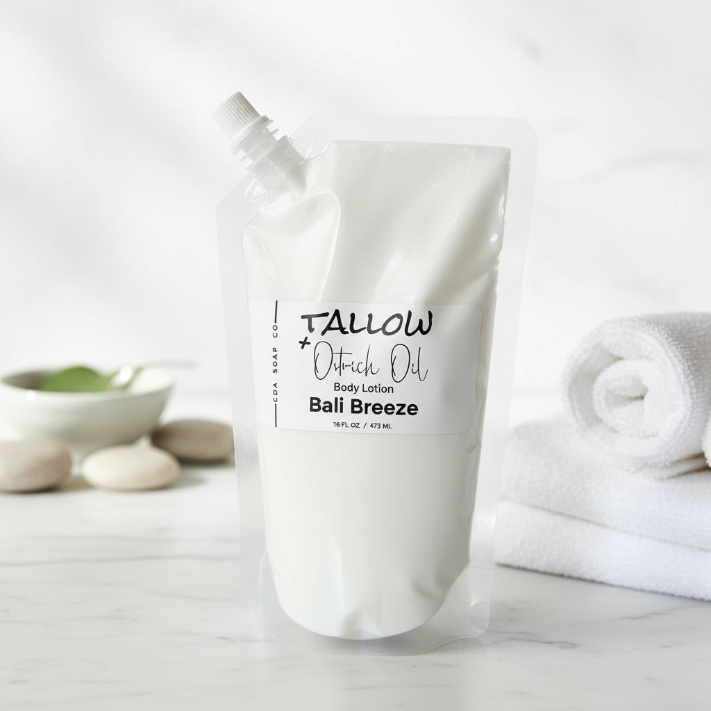 Body lotion pouch labeled 'Tallow + Ostrich Oil' on a marble surface