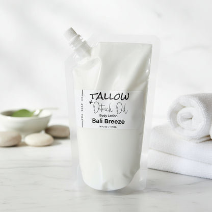 Body lotion pouch labeled 'Tallow + Ostrich Oil' on a marble surface