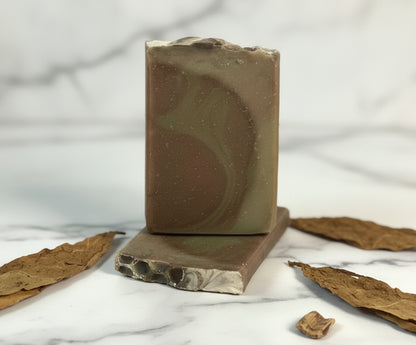 bars of soap with a marble background and tobacco accents