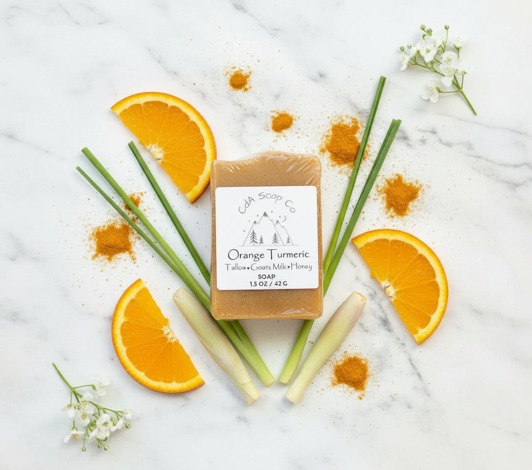 Bar of soap with orange and turmeric on a white background