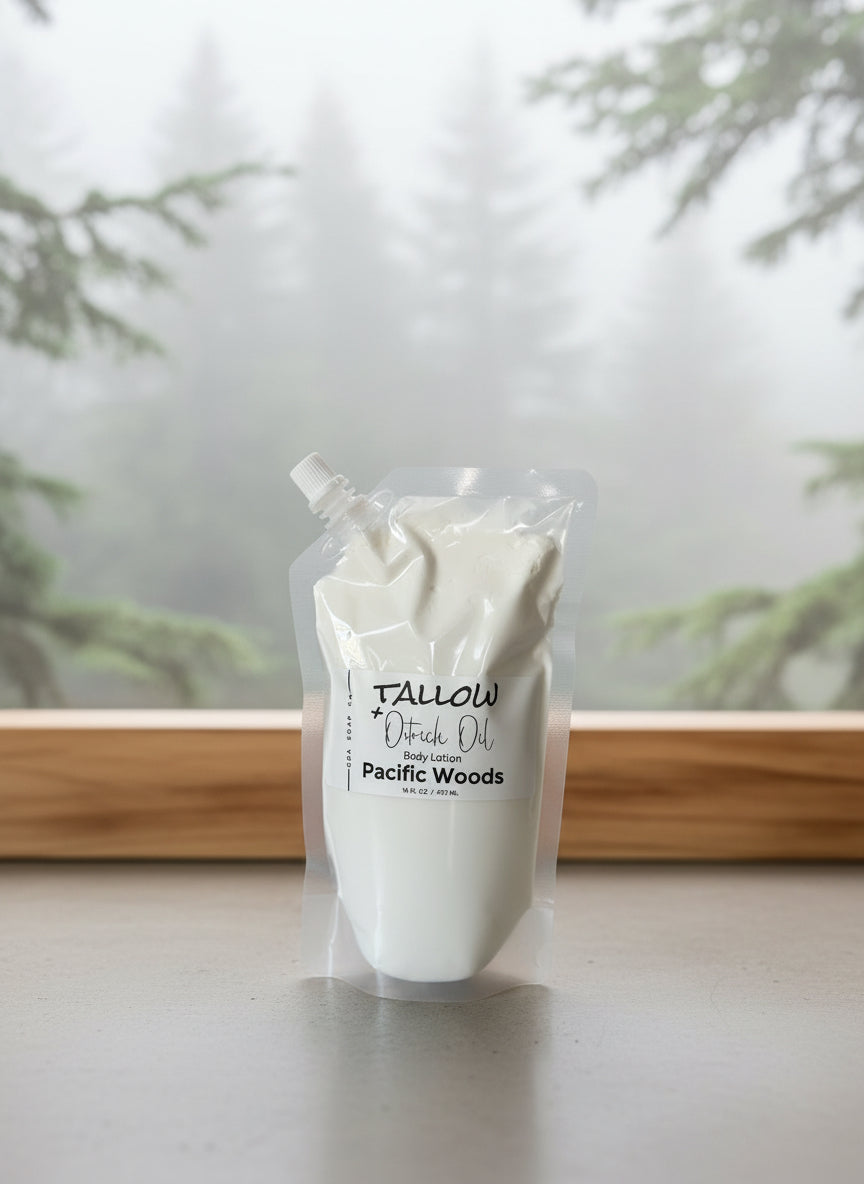 Pouch packaged lotion labeled 'Tallow' on a surface with a blurred natural background