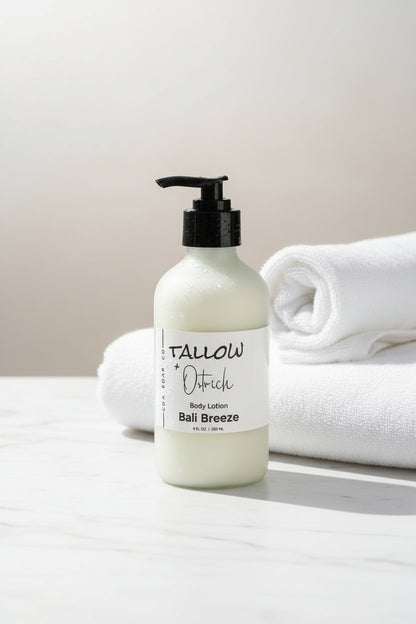 Bottle of Bali Breeze scented Tallow & Ostrich oil body lotion with white towels