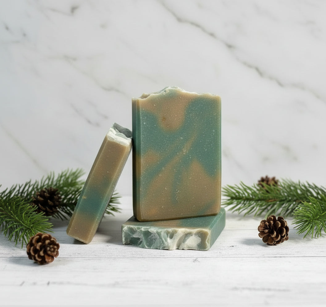 Bar of soap with green and brown swirled pattern on a wooden surface with a forest background