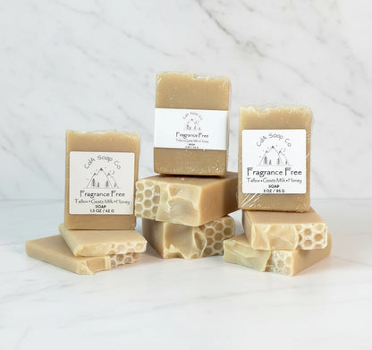 Collection of soap bars with 'Fragrance Free' labels on a marble surface.