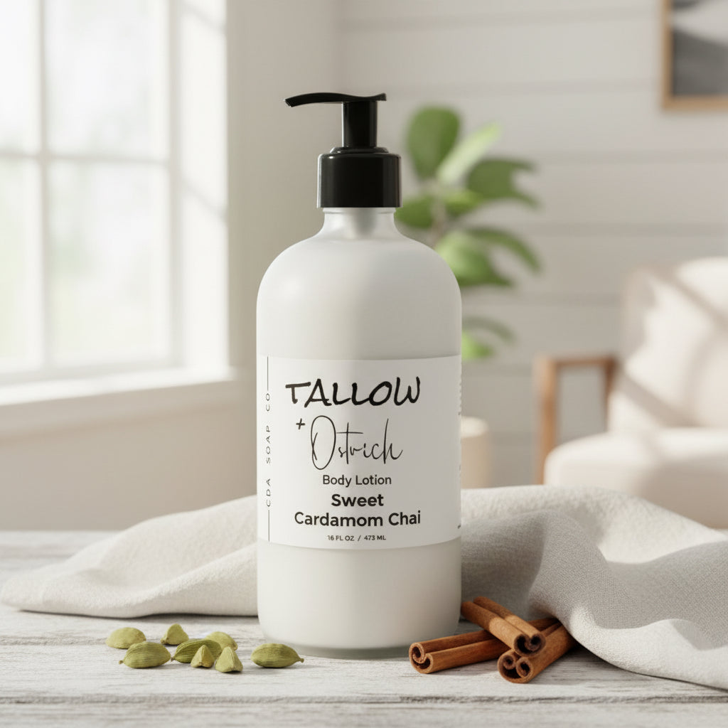 Body lotion bottle with 'Tallow + Ostrich' branding on a wooden surface with cinnamon sticks and cardamom pods.