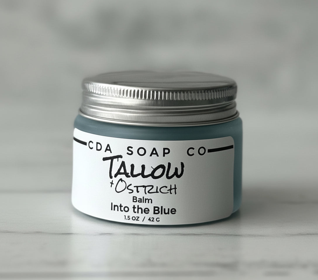 Jar of CDA Soap Co. Tallow & Ostrich Balm Into the Blue on a gray background