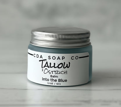 Jar of CDA Soap Co. Tallow & Ostrich Balm Into the Blue on a gray background