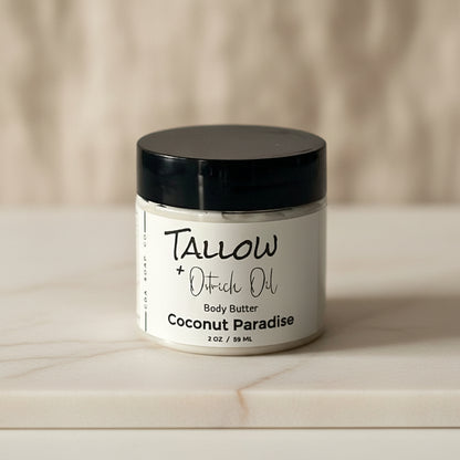 jar of tallow body butter on a marble surface