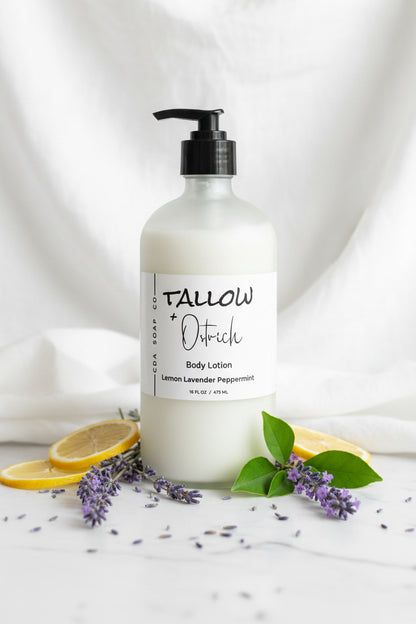 Lemon lavender peppermint tallow and ostrich oil Body lotion bottle with a label on a white background with lavender and lemon slices.