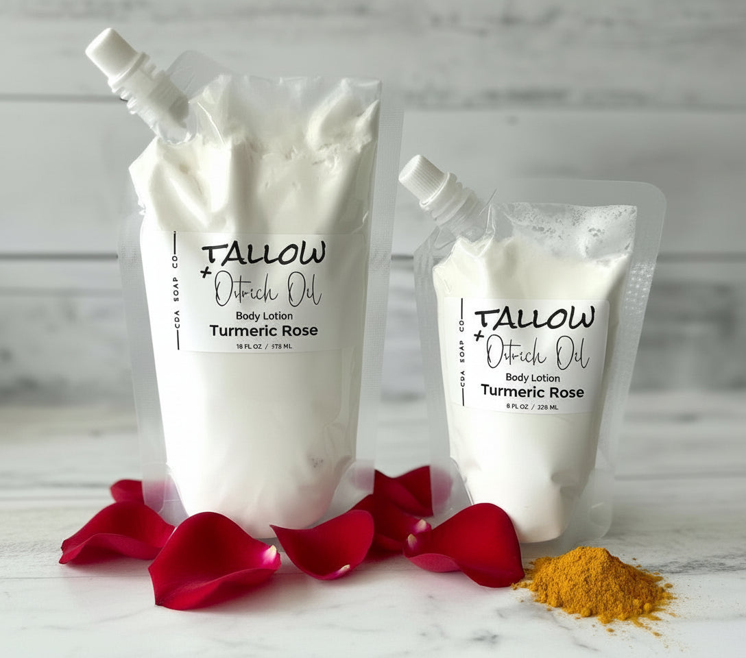 Two packages of Tallow + Oatrich Oil body lotion with turmeric and rose petals on a light background