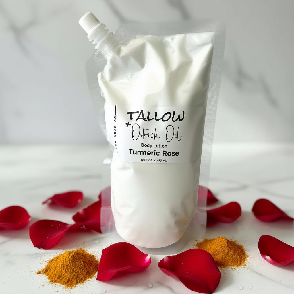 White body lotion pouch with 'Tallow & Oatrich Oil' branding on a marble surface with turmeric and rose petals.
