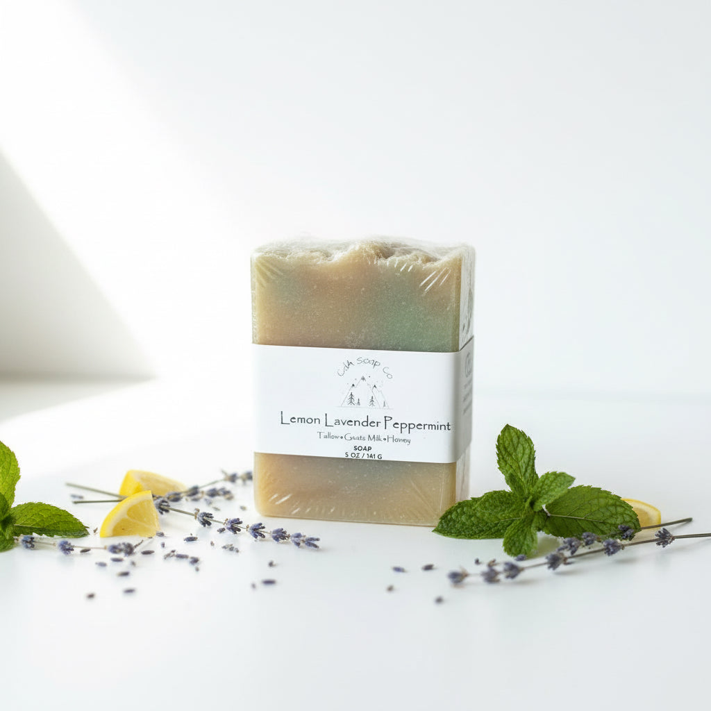 Bar of lemon lavender peppermint soap with a label on a wooden surface